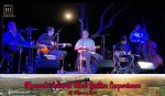 Photo of a group of professional musicians playing under the moon at the Hawaii Island Steel Guitar Experience at the Mauna Lani.