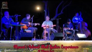 Photo of a group of professional musicians playing under the moon at the Hawaii Island Steel Guitar Experience at the Mauna Lani.
